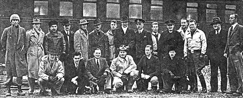 Photo: Some of the aircrew from the first Hudson deliveries. Standing: W.B. Lyons; D.L. Gentry; R. Adams; C.M. Tripp; W.C. Rodgers; J.A. Webber; J.D. McIntyre; S.T.B. Cripps; N.G. Mullett; A.M. Loughridge; A. Andrew; N.E. Smith; G.R. Hutchison; J.W. Gray; D.C.T. Bennett. Kneeling: D.B. Jarvis; H.G. Meyers; J.E. Giles; E.F. Clausewitz; K. Garden; W.T. Mellor.