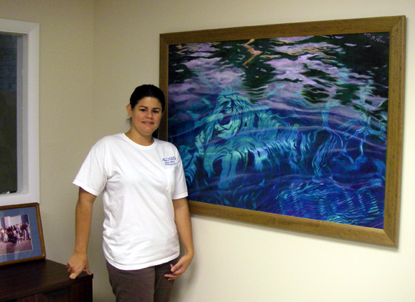 Allstate Resource Management employee Lari with large "Silver River: Depths & Reflections" giclée